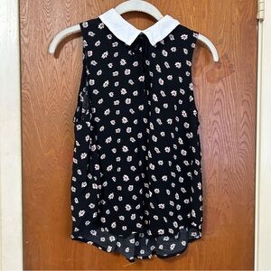 Black blouse with flowers and a white collar. Size M